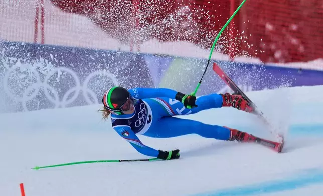 Italy's Sofia Goggia crashes as she speeds down the course during an alpine ski, downhill portion of a women's team combined race, at the 2026 Winter Olympics, in Cortina d'Ampezzo, Italy, Tuesday, Feb. 10, 2026. (AP Photo/Robert F. Bukaty)