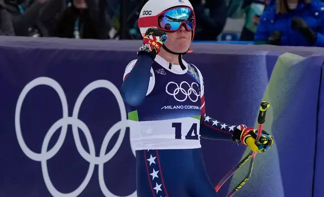 United States' Breezy Johnson celebrates at the finish area of an alpine ski, downhill portion of a women's team combined race, at the 2026 Winter Olympics, in Cortina d'Ampezzo, Italy, Tuesday, Feb. 10, 2026. (AP Photo/Andy Wong)