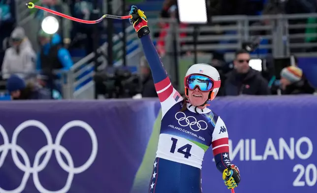 United States' Breezy Johnson celebrates at the finish area of an alpine ski, downhill portion of a women's team combined race, at the 2026 Winter Olympics, in Cortina d'Ampezzo, Italy, Tuesday, Feb. 10, 2026. (AP Photo/Andy Wong)