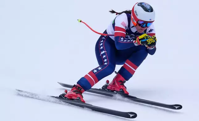 United States' Breezy Johnson speeds down the course during an alpine ski, downhill portion of a women's team combined race, at the 2026 Winter Olympics, in Cortina d'Ampezzo, Italy, Tuesday, Feb. 10, 2026. (AP Photo/Robert F. Bukaty)