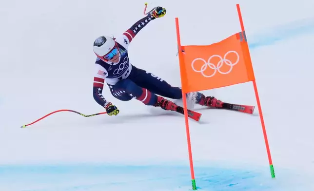 United States' Breezy Johnson speeds down the course during an alpine ski, downhill portion of a women's team combined race, at the 2026 Winter Olympics, in Cortina d'Ampezzo, Italy, Tuesday, Feb. 10, 2026. (AP Photo/Robert F. Bukaty)
