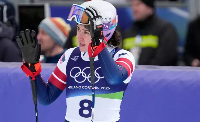 United States' Jacqueline Wiles waves at the finish area of an alpine ski, downhill portion of a women's team combined race, at the 2026 Winter Olympics, in Cortina d'Ampezzo, Italy, Tuesday, Feb. 10, 2026. (AP Photo/Andy Wong)
