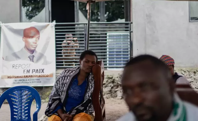 People attend a memorial Nguvumali Kalabosh Bosco, who died when tunnels collapsed at a major coltan mining site due to landslides, in Goma, eastern Congo, Monday, Feb. 2, 2026. (AP Photo/Moses Sawasawa)