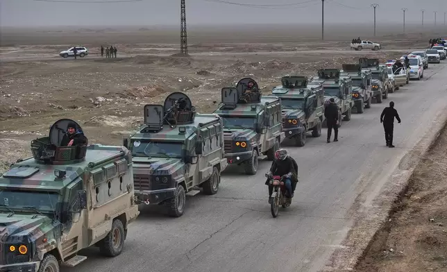Syrian security forces gather before entering the town of al-Hassakeh to implement an agreement with the Kurdish-led Syrian Democratic Forces (SDF) to stabilize a ceasefire, in Wadi al-Raml, al-Hassakeh province, eastern Syria, Monday, Feb. 2, 2026. (AP Photo/Ghaith Alsayed)