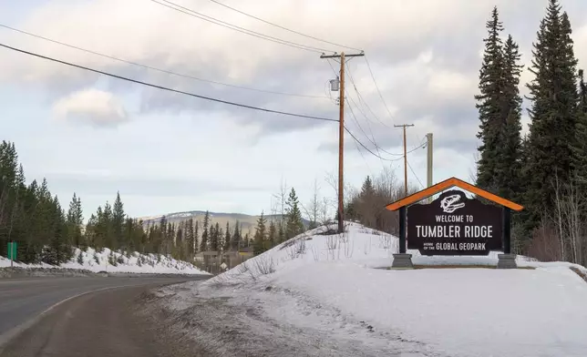 A welcome sign is seen entering the town of Tumbler Ridge, British Columbia, Canada, on Thursday, Feb. 12, 2026. (Christinne Muschi/The Canadian Press via AP)