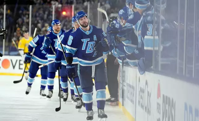 Tampa Bay Lightning right wing Nikita Kucherov (86) celebrates with the bench after his goal against the Boston Bruins during the thirdd period of a Stadium Series NHL hockey game Sunday, Feb. 1, 2026, in Tampa, Fla. (AP Photo/Chris O'Meara)
