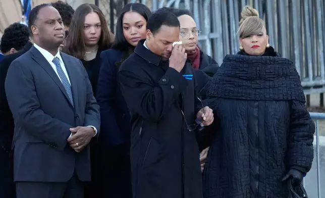 The family of Reverend Jesse Jackson arrives as Yusep Jackson wipes his eyes before public visitation at Rainbow/PUSH Coalition in Chicago, Thursday, Feb. 26, 2026. (AP Photo/Nam Y. Huh)