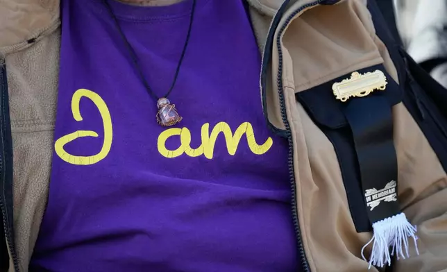 Nevens Woods wears a black ribbon for respect while waiting to enter the public visitation for Reverend Jesse Jackson at Rainbow/PUSH Coalition in Chicago, Friday, Feb. 27, 2026. (AP Photo/Nam Y. Huh)