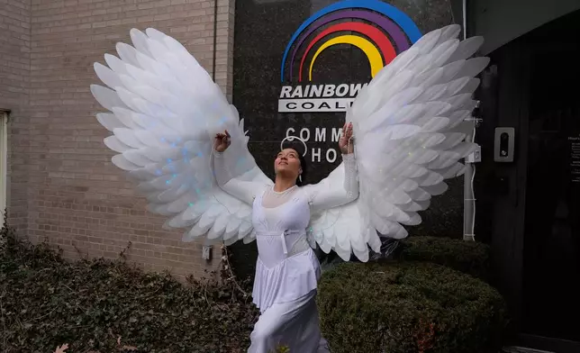Phoenix Ellington dressed as an angel spreads her wings at a public visitation for the Rev. Jesse Jackson at Rainbow PUSH Coalition headquarters, Thursday, Feb. 26, 2026, in Chicago. (AP Photo/Erin Hooley)