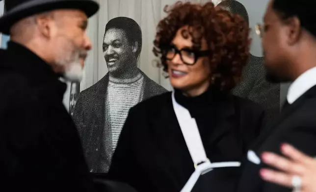 A cutout of Rev. Jesse Jackson is seen through the crowd during a public visitation for him at Rainbow PUSH Coalition headquarters Friday, Feb. 27, 2026, in Chicago. (AP Photo/Erin Hooley)