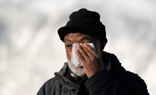 A man wipes his eyes before the public visitation for Reverend Jesse Jackson at Rainbow/PUSH Coalition in Chicago, Friday, Feb. 27, 2026. (AP Photo/Nam Y. Huh)