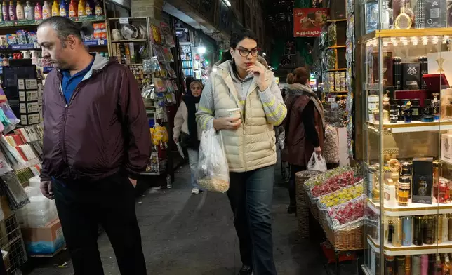 People walk through the Tajrish bazaar market in northern Tehran, Iran, Tuesday, Jan. 27, 2026. (AP Photo/Vahid Salemi)