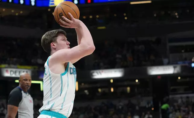 Charlotte Hornets guard Kon Knueppel shoots a 3-point shot against the Indiana Pacers during the first half of an NBA basketball game in Indianapolis, Thursday, Feb. 26, 2026. (AP Photo/AJ Mast)