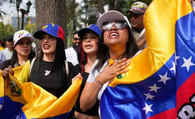 FILE - Venezuelan nationals celebrate after U.S. President Donald Trump announced that President Nicolas Maduro had been captured and flown out of Venezuela, in Lima, Peru, Jan. 3, 2026. (AP Photo/Martin Mejia, File)