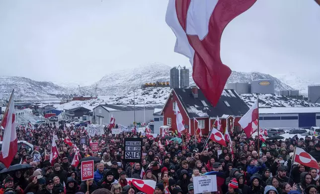 FILE - Residents protest against President Donald Trump's policy towards Greenland in front of the US consulate in Nuuk, Greenland, Jan. 17, 2026. (AP Photo/Evgeniy Maloletka, File)