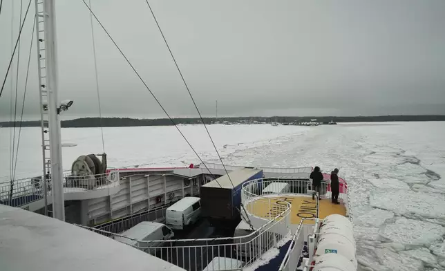 A ferry approaches into the frozen Baltic Sea from island of Hiuumaa, Estonia, Tuesday, Feb. 10, 2026. (AP Photo/Kostya Manekov)