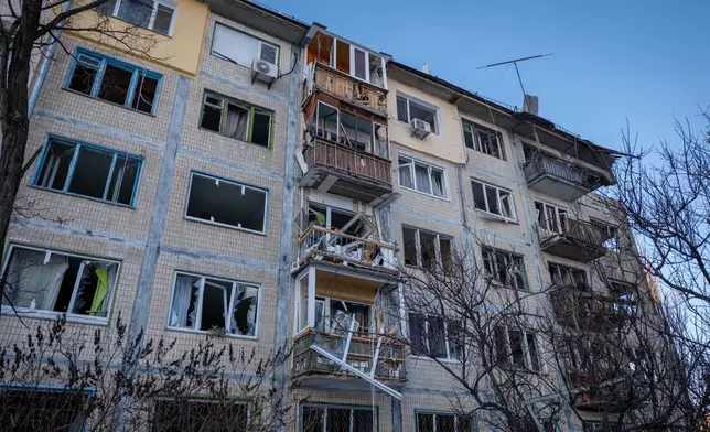 A damaged apartment house is seen following Russia's missile and drone attack in Kyiv, Ukraine, Tuesday, Feb. 3, 2026. (AP Photo/Dan Bashakov)