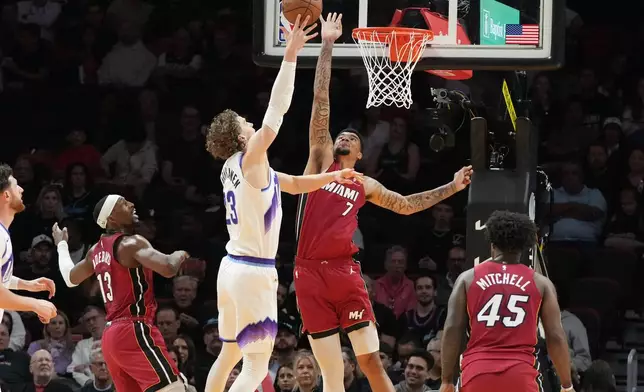 Utah Jazz forward Lauri Markkanen (23) drives to the basket as Miami Heat center Kel'el Ware (7) defends during the first half of an NBA basketball game Monday, Feb. 9, 2026, in Miami. (AP Photo/Marta Lavandier)