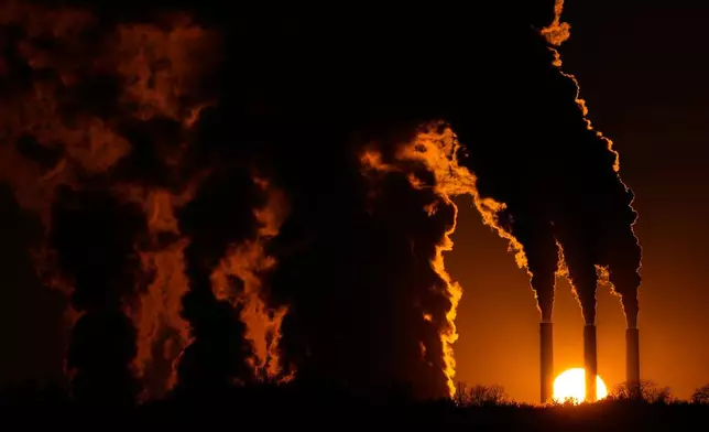 FILE - The Jeffrey Energy Center coal-fired power plant operates at sunset near Emmett, Kan., Jan. 3, 2026, in Topeka, Kan. (AP Photo/Charlie Riedel, file)