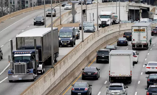 FILE - Motor vehicle traffic moves along the Interstate 76 highway in Philadelphia, March 31, 2021. (AP Photo/Matt Rourke, File)