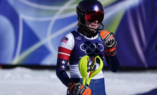 United States' Mikaela Shiffrin is overcome with emotion after winning an alpine ski, women's slalom race, at the 2026 Winter Olympics, in Cortina d'Ampezzo, Italy, Wednesday, Feb. 18, 2026. (AP Photo/Jacquelyn Martin)