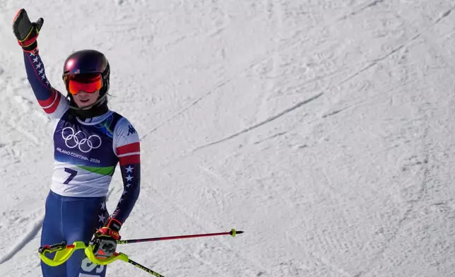 United States' Mikaela Shiffrin celebrates winning an alpine ski, women's slalom race, at the 2026 Winter Olympics, in Cortina d'Ampezzo, Italy, Wednesday, Feb. 18, 2026. (AP Photo/Andy Wong)