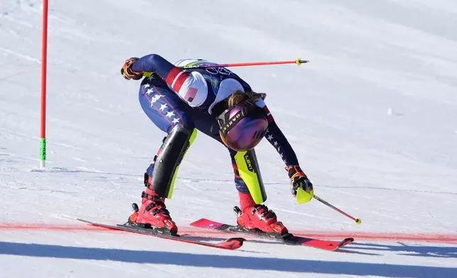 United States' Mikaela Shiffrin crosses the finish line to win an alpine ski, women's slalom race, at the 2026 Winter Olympics, in Cortina d'Ampezzo, Italy, Wednesday, Feb. 18, 2026. (AP Photo/Jacquelyn Martin)