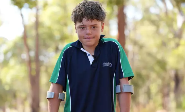 Austin Appelbee poses for a photo in Gidgegannup, Australia, Tuesday Feb. 3, 2026, after the 13-year-old made an hourslong swim to raise an alarm after his family was swept out to sea off the Australian coast. (Briana Shepherd/ABC via AP)
