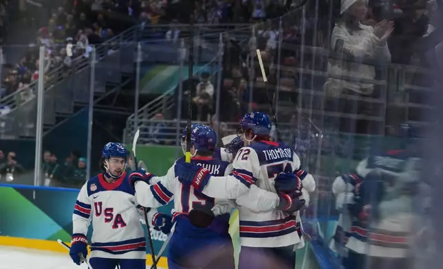 United States' Auston Matthews celebrates with his teammates after scoring his side's second goal during a preliminary round game of men's ice hockey between the United States and Germany at the 2026 Winter Olympics, in Milan, Italy, Sunday, Feb. 15, 2026. (AP Photo/Carolyn Kaster)