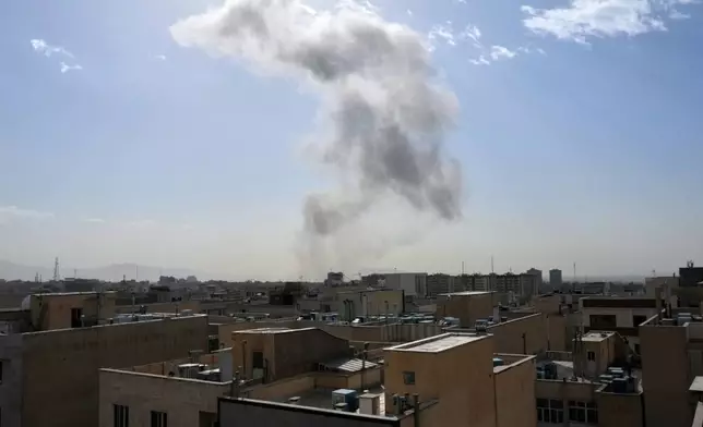 Smoke rises on the skyline after an explosion in Tehran, Iran, Saturday, Feb. 28, 2026.(AP Photo/Vahid Salemi)