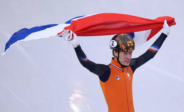 Jens van 't Wout of the Netherlands wins gold during the short track speed skating men's 1000m at the 2026 Winter Olympics, in Milan, Italy, Thursday, Feb. 12, 2026. (AP Photo/Stephanie Scarbrough)