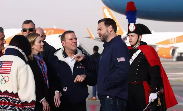 U.S. Ambassador to Italy and San Marino Tilman Fertitta and his wife Paige Fertitta welcome Vice President JD Vance and second lady Usha Vance as they arrive ahead of the Milano Cortina 2026 Winter Olympics in Milan, Italy, Thursday, Feb. 5, 2026. (Kevin Lamarque/Pool Photo via AP)