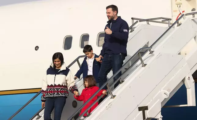 Vice President JD Vance, second lady Usha Vance and their children Mirabel and Vivek disembark Air Force Two as they arrive ahead of the Milano Cortina 2026 Winter Olympics in Milan, Italy, Thursday, Feb. 5, 2026. (Kevin Lamarque/Pool Photo via AP)