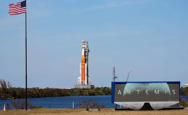 NASA's Artemis II SLS (Space Launch System) moon rocket with the Orion spacecraft slowly rolls back towards the Vehicle Assembly Building at the Kennedy Space Center, Wednesday, Feb. 25, 2026, in Cape Canaveral, Fla. (AP Photo/John Raoux)