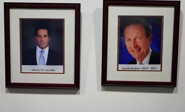 An official portrait of LAUSD Superintendents, Alberto Carvalho, left, and former Superintendent Austin Beutner, are displayed at Los Angeles Unified School District board room at LAUSD headquarters, Thursday, Feb. 26, 2026, in Los Angeles. (AP Photo/Damian Dovarganes)