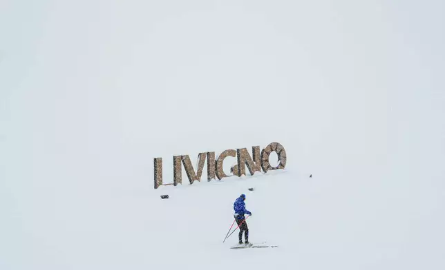 A person cross-country skis, Thursday, Feb. 19, 2026, during the 2026 Winter Olympics in Livigno, Italy. (AP Photo/Julia Demaree Nikhinson)