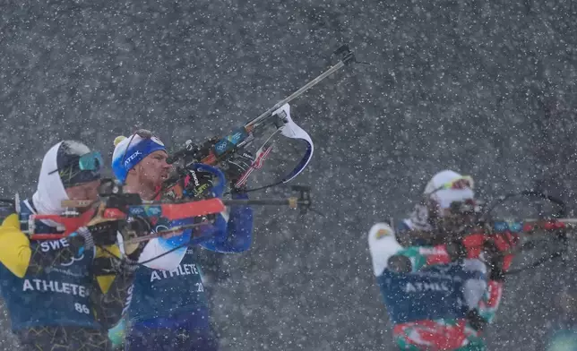 Vitezslav Hornig, of Czechia, center, participates in a biathlon training session at the 2026 Winter Olympics in Anterselva, Italy, Thursday, Feb. 19, 2026. (AP Photo/Andrew Medichini)
