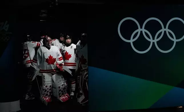 Canada's players arrive for the warm up ahead of a women's ice hockey gold medal game between the United States and Canada at the 2026 Winter Olympics, in Milan, Italy, Thursday, Feb. 19, 2026. (AP Photo/Petr David Josek)