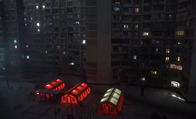 FILE - Emergency tents are set up in a residential neighborhood where people can warm up following Russia's regular air attacks against the country's energy infrastructure that leave residents without power, water and heating in the dead of winter, in Kyiv, Ukraine, Thursday, Jan. 15, 2026. (AP Photo/Vladyslav Musiienko, File)