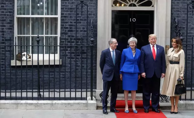 Britain's Prime Minister Theresa May and her husband Philip greet President Donald Trump and first lady Melania outside 10 Downing Street in central London, Tuesday, June 4, 2019. (AP Photo/Kirsty Wigglesworth, File)