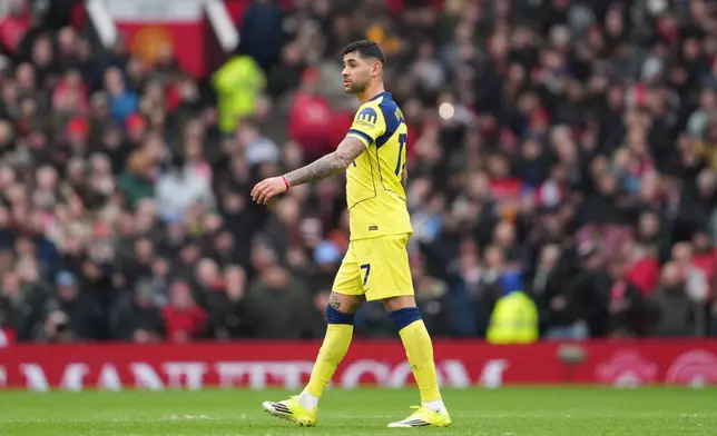 Tottenham's Cristian Romero walks off after receiving a red card during the English Premier League soccer match between Manchester United and Tottenham in Manchester, England, Saturday, Feb. 7, 2026. (AP Photo/Jon Super)