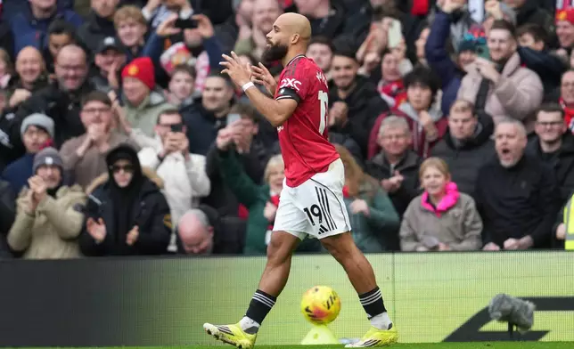 Manchester United's Bryan Mbeumo reacts after scoring during the English Premier League soccer match between Manchester United and Tottenham in Manchester, England, Saturday, Feb. 7, 2026. (AP Photo/Jon Super)