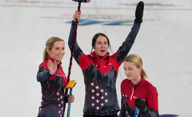 United States' Tabitha Peterson, Taylor Anderson-Heide, and Cory Thiesse react after the women's curling round robin session against Canada, at the 2026 Winter Olympics, in Cortina d'Ampezzo, Italy, Friday, Feb. 13, 2026. (AP Photo/Misper Apawu)