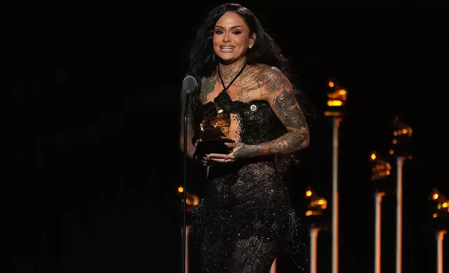Kehlani accepts the award for best R&amp;B performance for "Folded" during the 68th annual Grammy Awards on Sunday, Feb. 1, 2026, in Los Angeles. (AP Photo/Chris Pizzello)