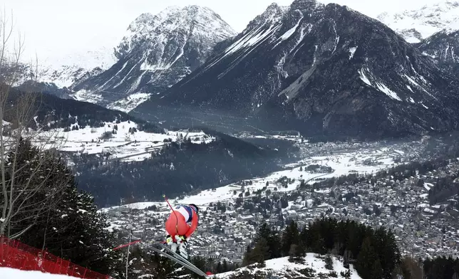 Switzerland's Franjo von Allmen speeds down the course during an alpine ski, men's downhill official training, at the 2026 Winter Olympics, in Bormio, Italy, Friday, Feb. 6, 2026. (AP Photo/Gabriele Facciotti)