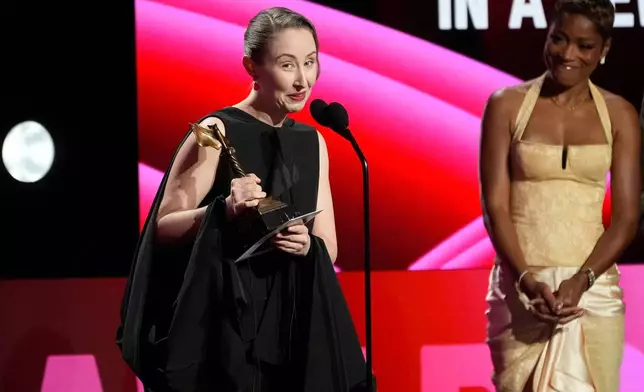 Erin Doherty accepts the award for best supporting performance in a new scripted series for "Adolescence" during the Film Independent Spirit Awards on Sunday, Feb. 15, 2026, at the Hollywood Palladium in Los Angeles. Kee Palmer looks on from right.(AP Photo/Chris Pizzello)