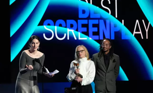 Eva Victor, left, accept the award for best screenplay for "Sorry, Baby" during the Film Independent Spirit Awards on Sunday, Feb. 15, 2026, at the Hollywood Palladium in Los Angeles. Amy Madigan looks on from right.(AP Photo/Chris Pizzello)