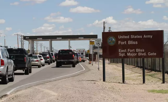 FILE - Cars wait to enter Fort Bliss in El Paso, Texas, Sept. 9, 2014. (AP Photo/Juan Carlos Llorca, File)