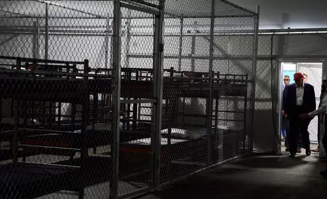FILE - President Donald Trump tours "Alligator Alcatraz," a new migrant detention facility at Dade-Collier Training and Transition facility, on July 1, 2025, in Ochopee, Fla. (AP Photo/Evan Vucci, File)