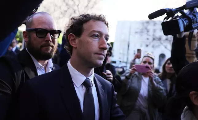 Meta CEO Mark Zuckerberg arrives for a landmark trial over whether social media platforms deliberately addict and harm children, Wednesday, Feb. 18, 2026, in Los Angeles. (AP Photo/Ryan Sun)